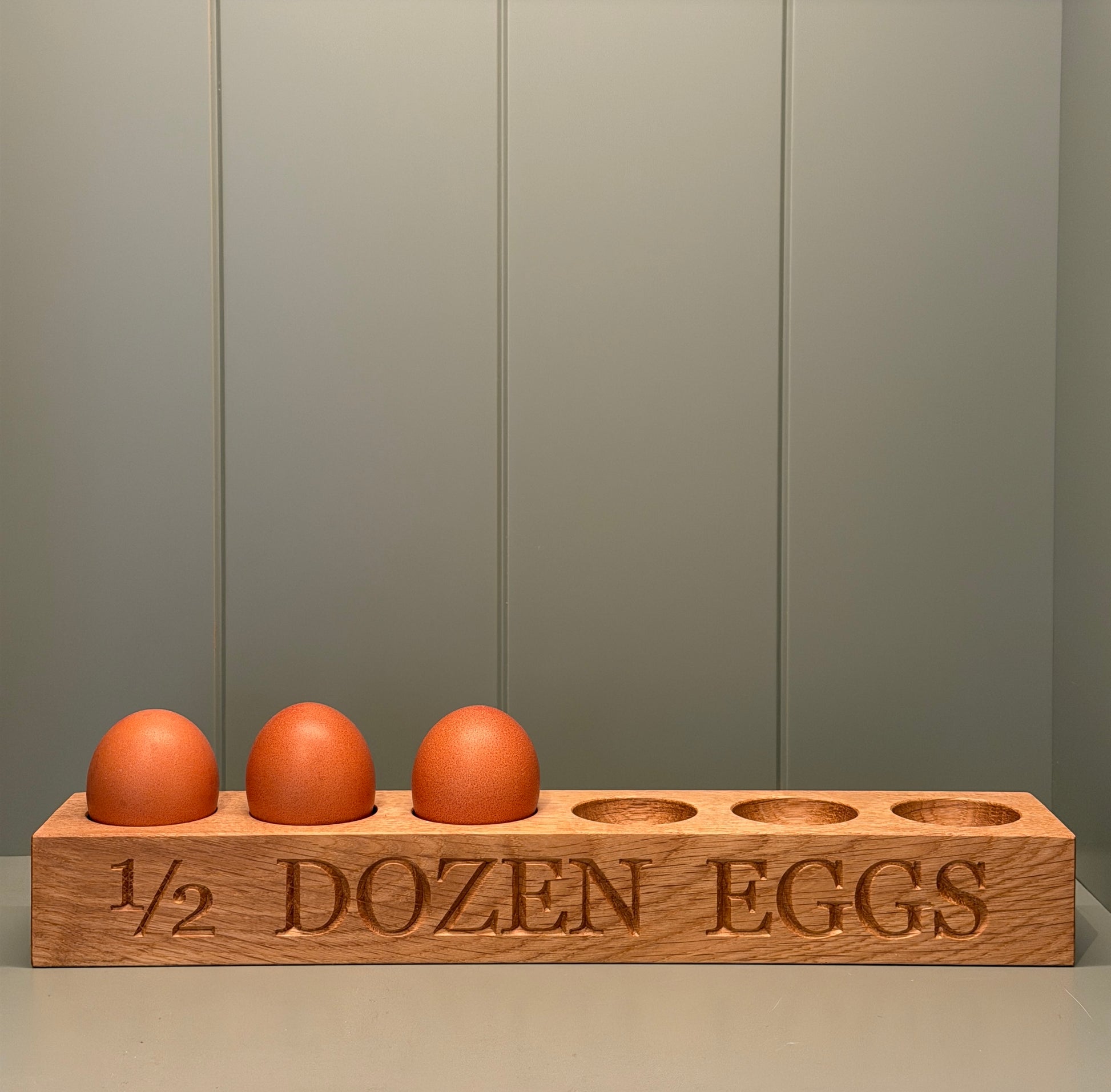 Egg storage holder with 1/2 DOZEN EGGS  engraved along the front