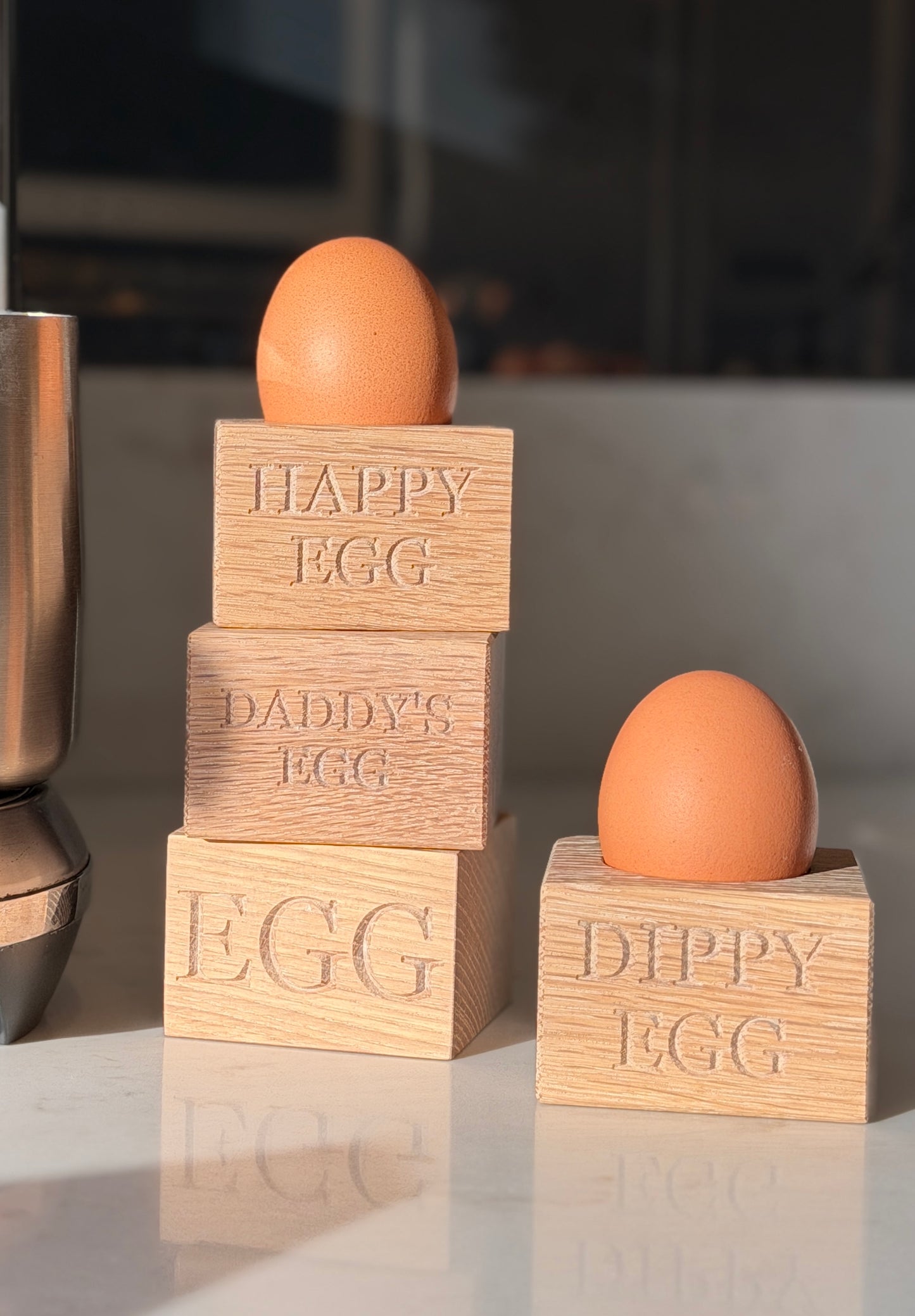 Oak cube egg cups personalised engraving in a sunny kitchen