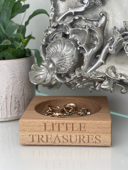 Oak square jewelry storage with  'Little Treasures' engraving.  Circular hole carved out with with jewelry. 